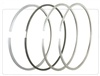 Outboard piston rings